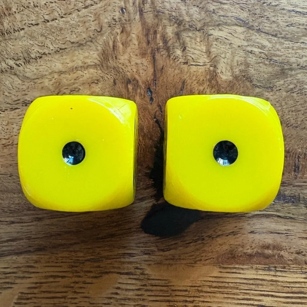 Vintage pair of yellow and black large dice